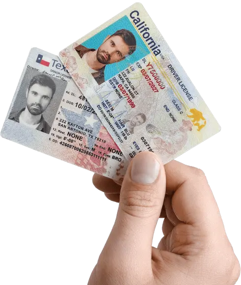 Hand holding multiple ID cards